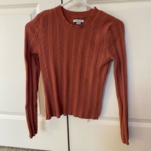 Pink/orange colored  American eagle cropped shirt.